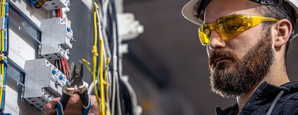 electrician working on electrical box