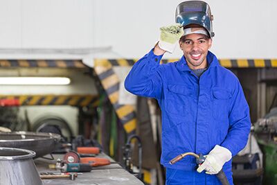 welding student with gloves and helmet