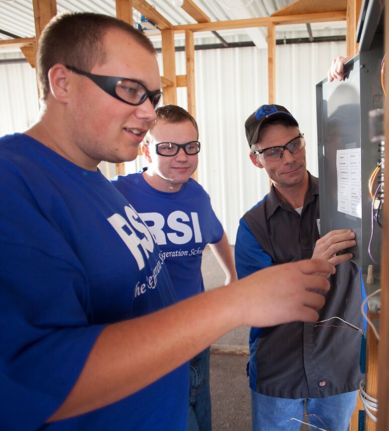 trade school teacher with hands on training