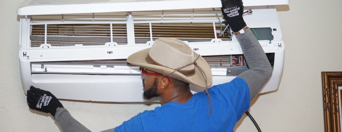 hvac student installing ductless ac unit