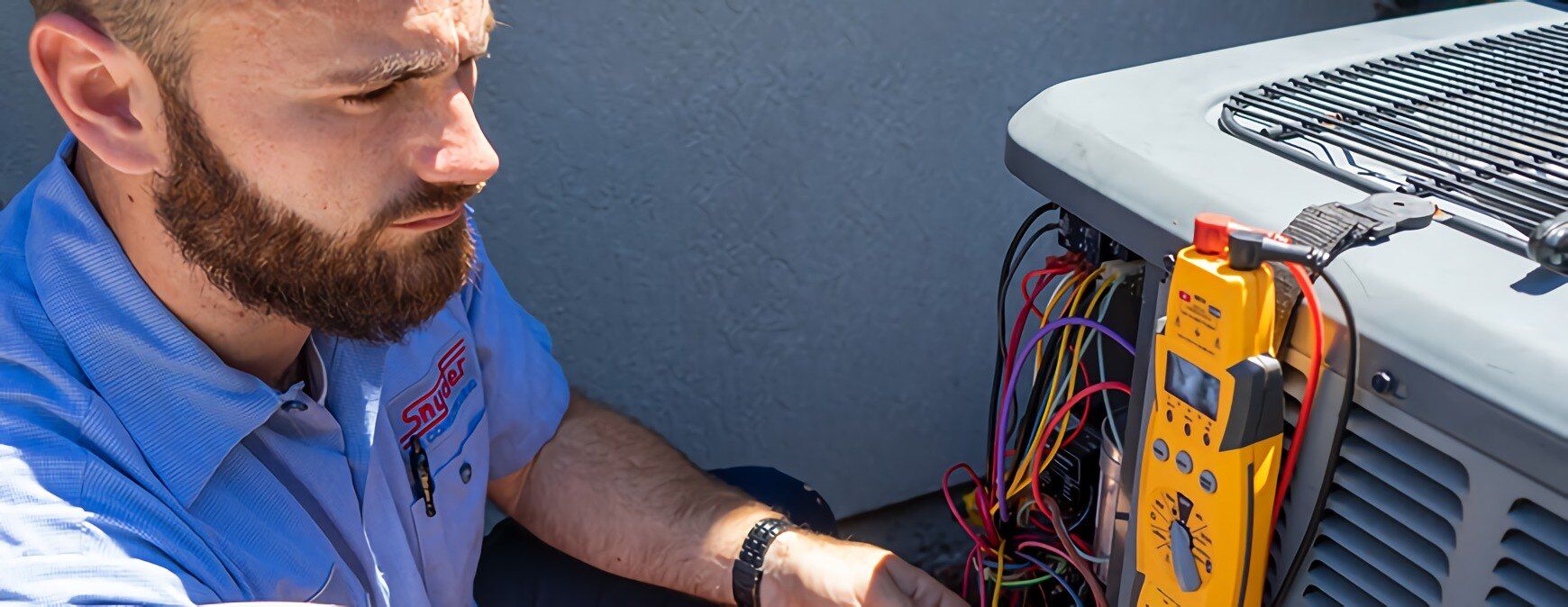 hvac technician working on outside unit