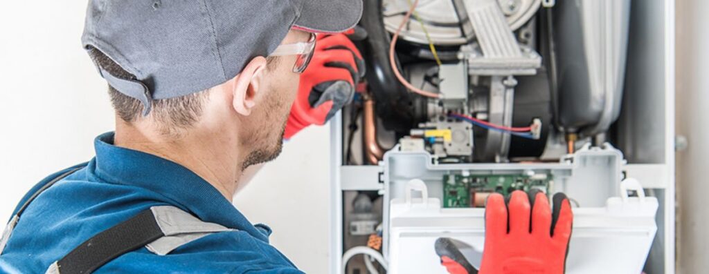 hvac tech opening up a furnace